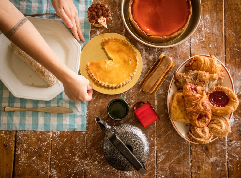 Pies and sweet pastries being served on a table