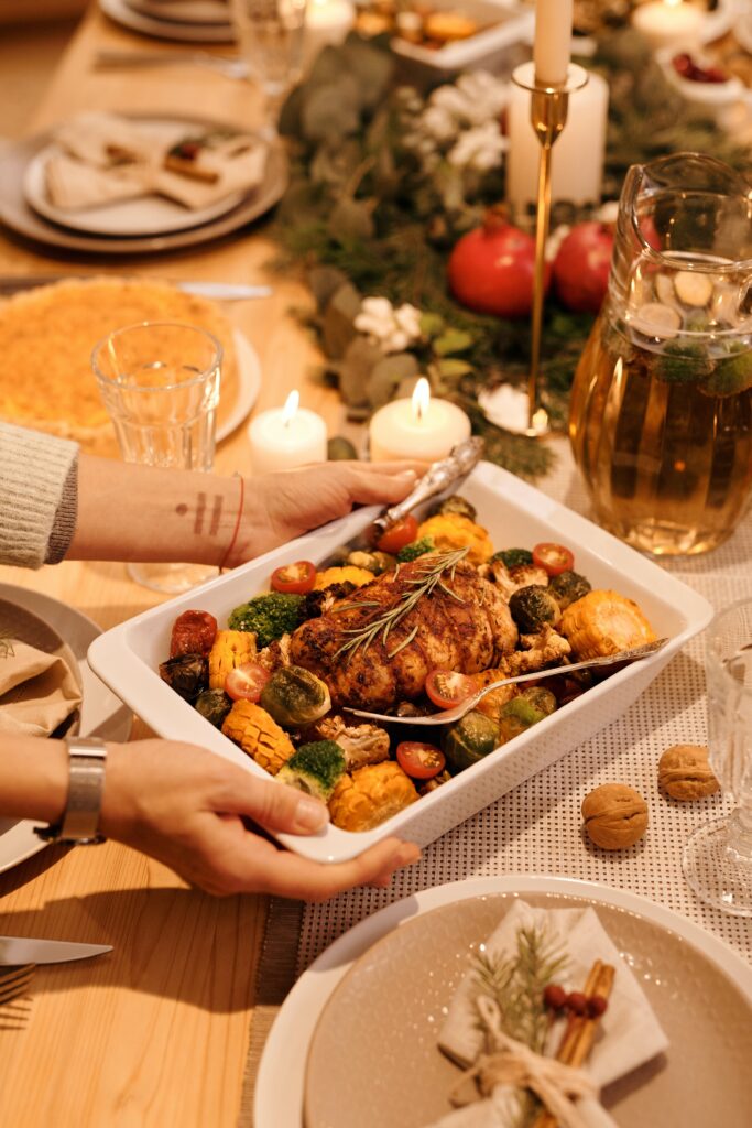 A meal of meat with plenty of vegetables served in a casserole dish