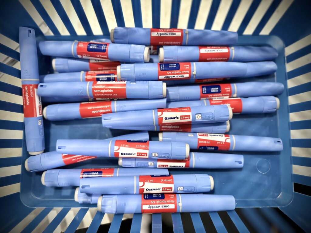 A bunch of Ozempic pens in a basket.