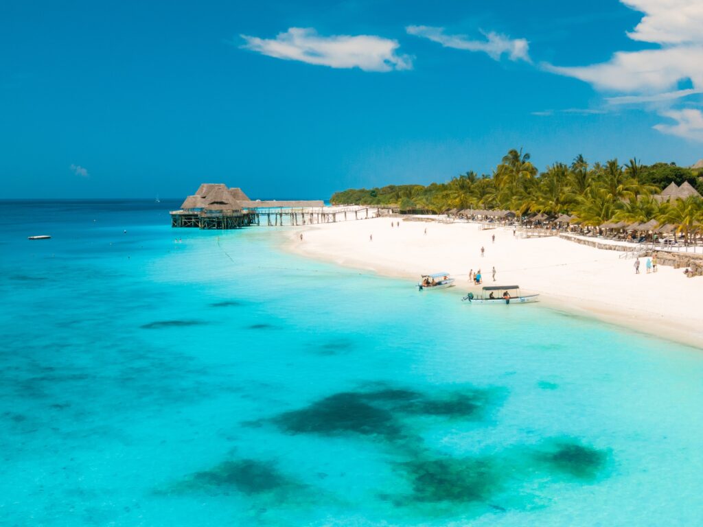 white sand beach with clear blue seawater