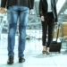 close-up-two-asian-business-partners-with-face-mask-protection-social-distancing-new-normal-lifestyle-business-travellers-walking-airport-with-luggage-scaled.